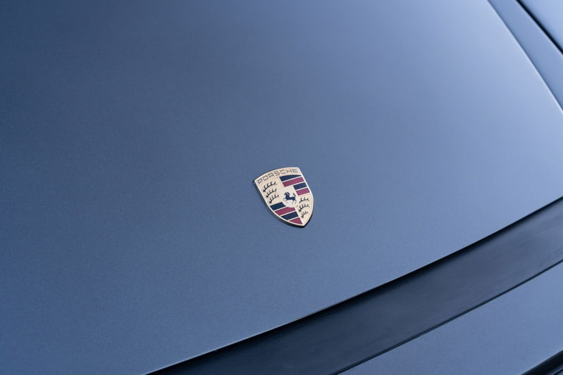Slate Grey Metallic 1989 Porsche 930 Turbo Flachbau emblem on hood.