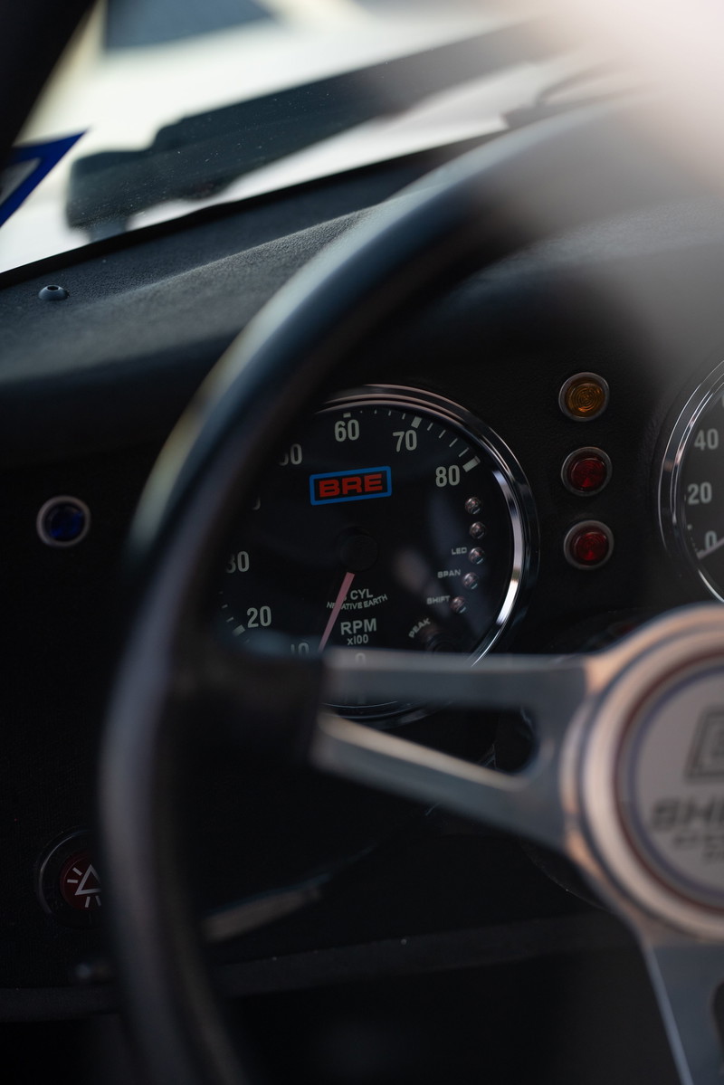 Classic 1965 Superformance Shelby Daytona CSX Coupe dashboard with BRE tachometer.