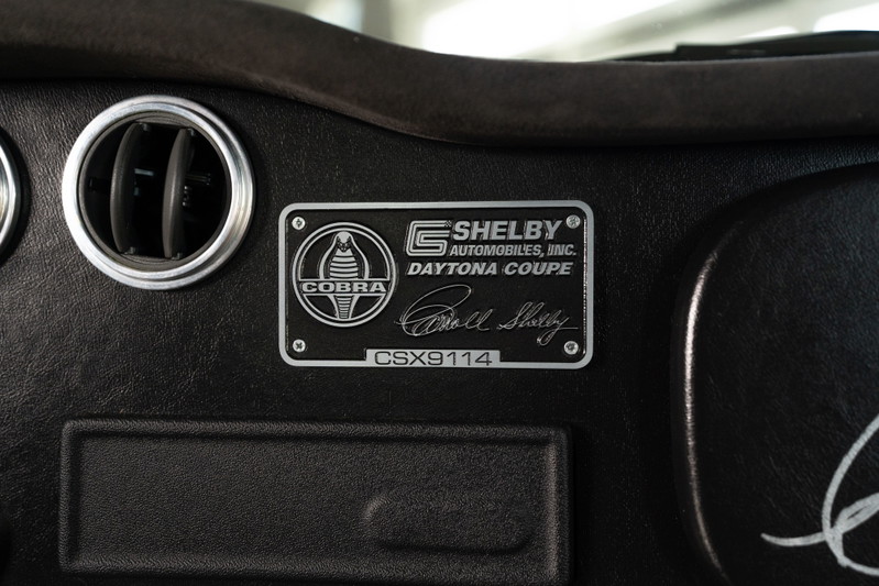 Shelby Daytona Coupe CSX9114 dash plaque, featuring Cobra emblem and Bill Shelby signature.