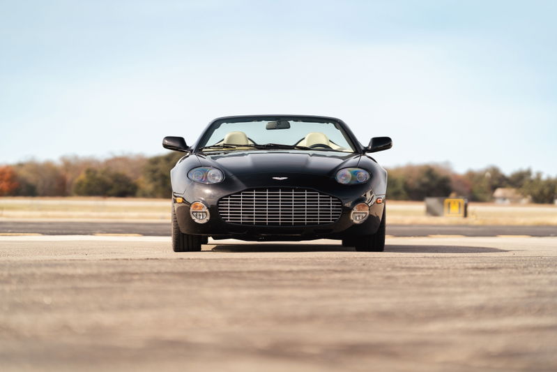 Black 2003 Aston Martin DB AR1 Zagato convertible with tan interior and chrome grille.