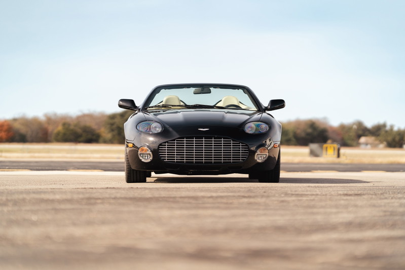 Black 2003 Aston Martin DB AR1 Zagato convertible with tan interior and chrome grille.