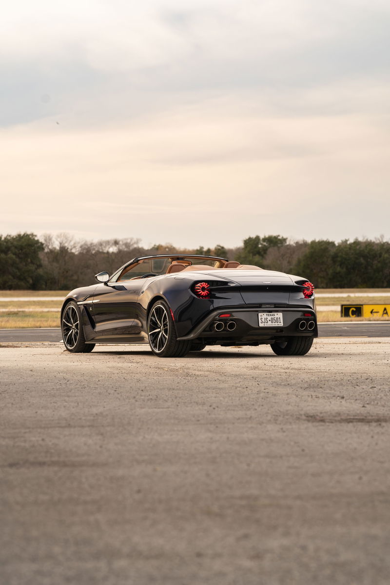 Rear view of an Orient Blue 2018 Aston Martin Vanquish Zagato Volante with tan interior and multi-spoke rims.