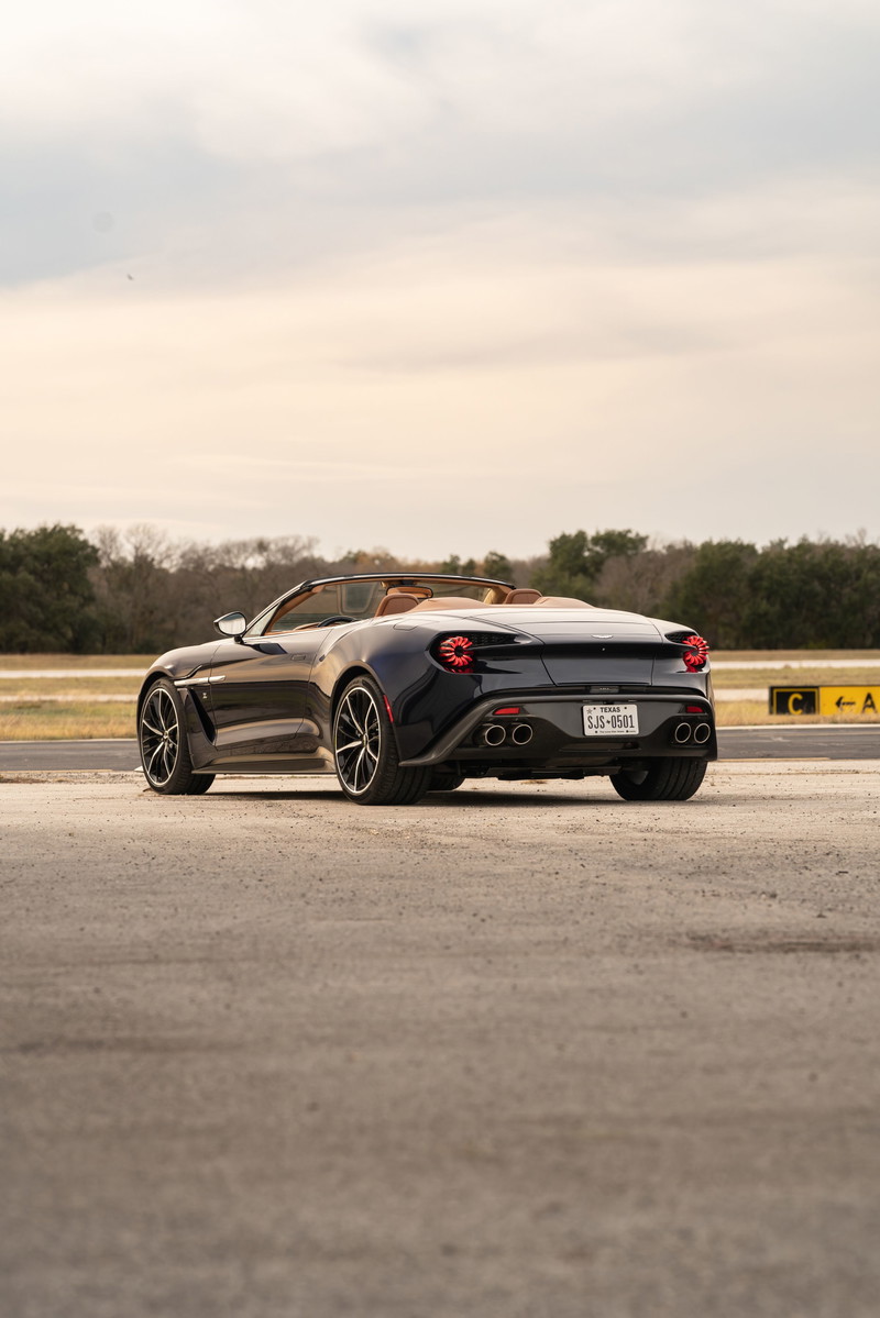 Rear view of an Orient Blue 2018 Aston Martin Vanquish Zagato Volante with tan interior and multi-spoke rims.
