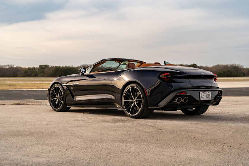 2018 Aston Martin Vanquish Zagato Volante in Orient Blue, rear 3/4 view, with black rims and tan interior.