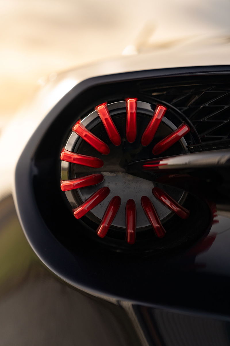 Close-up of a 2018 Aston Martin Vanquish Zagato's exhaust tip with red accents.