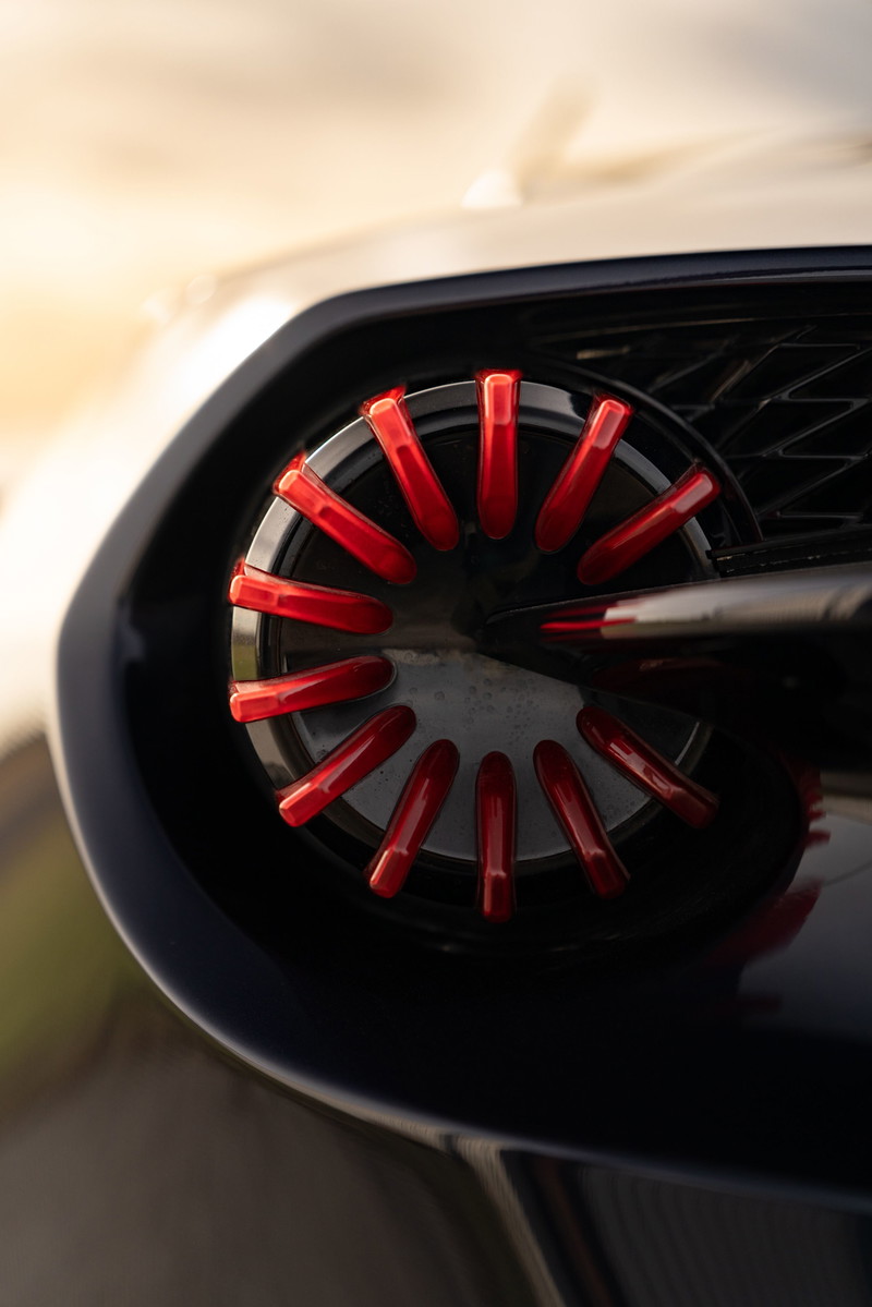 Close-up of a 2018 Aston Martin Vanquish Zagato's exhaust tip with red accents.
