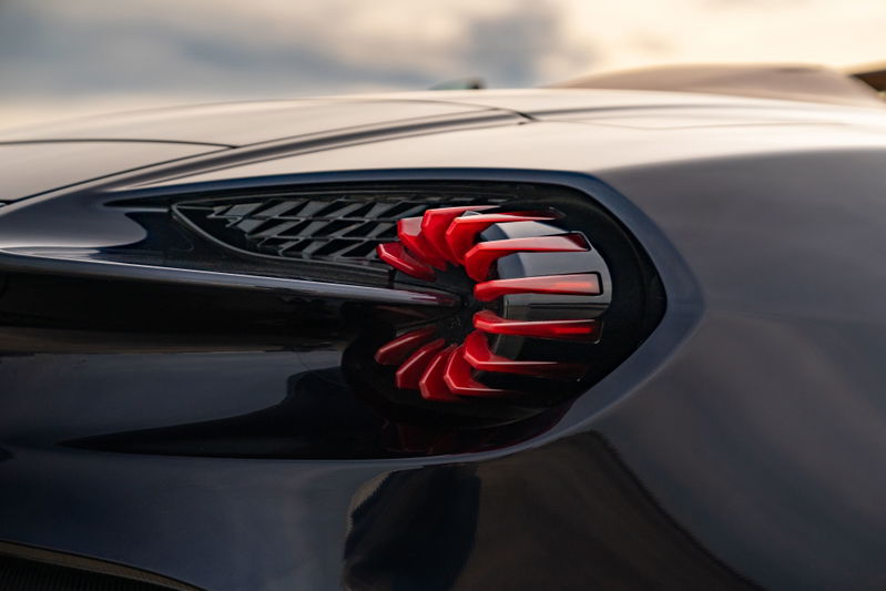 Close-up of the unique red turbine-style taillight on an Orient Blue 2018 Aston Martin Vanquish Zagato.