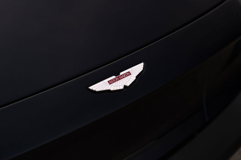Close-up of the Aston Martin wings badge on the hood of an Orient Blue 2018 Vanquish Zagato.