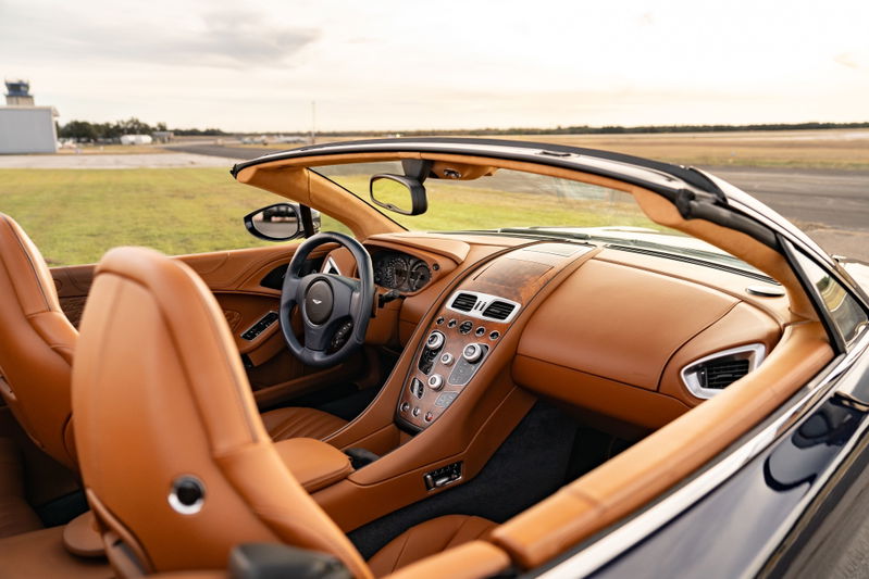 2018 Aston Martin Vanquish Zagato convertible interior: Tan leather seats and trim, wood dash accents.