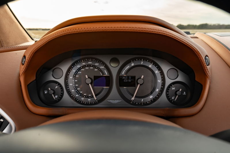 2018 Aston Martin Vanquish Zagato dashboard: brown leather trim, silver gauges, digital display.