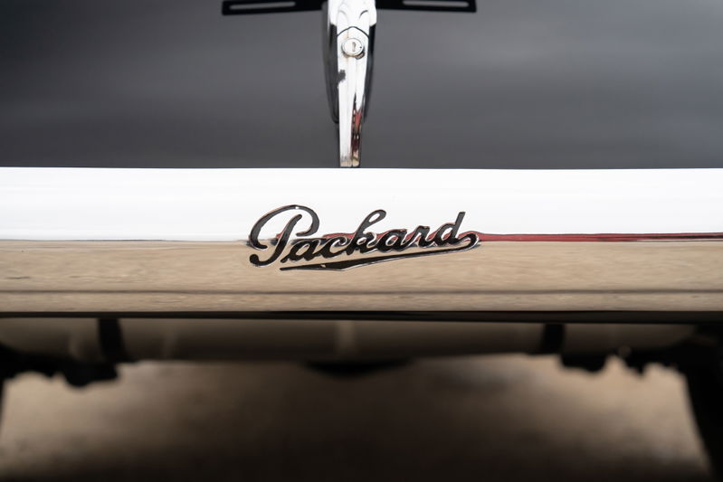 Packard Super Eight One Eighty emblem on chrome trim.