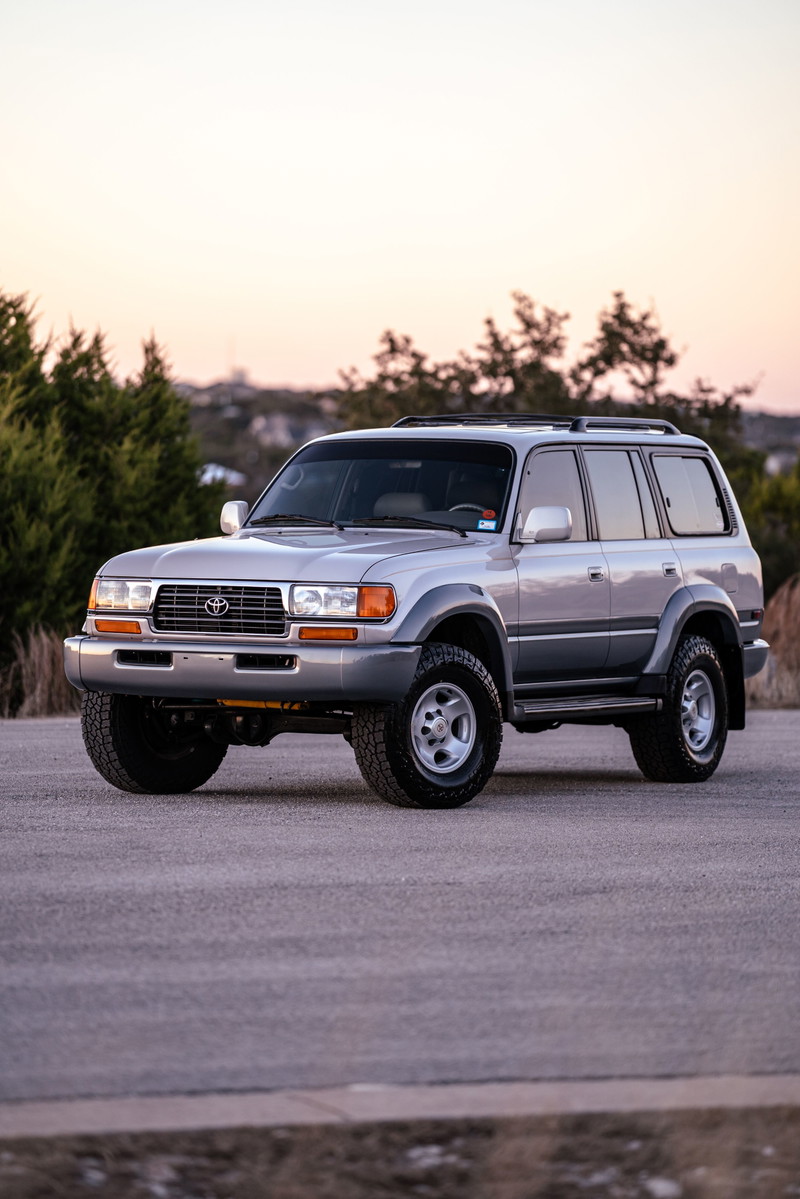 1997 Toyota Land Cruiser FJ80 in Desert Dune Metallic, stock rims and trim.