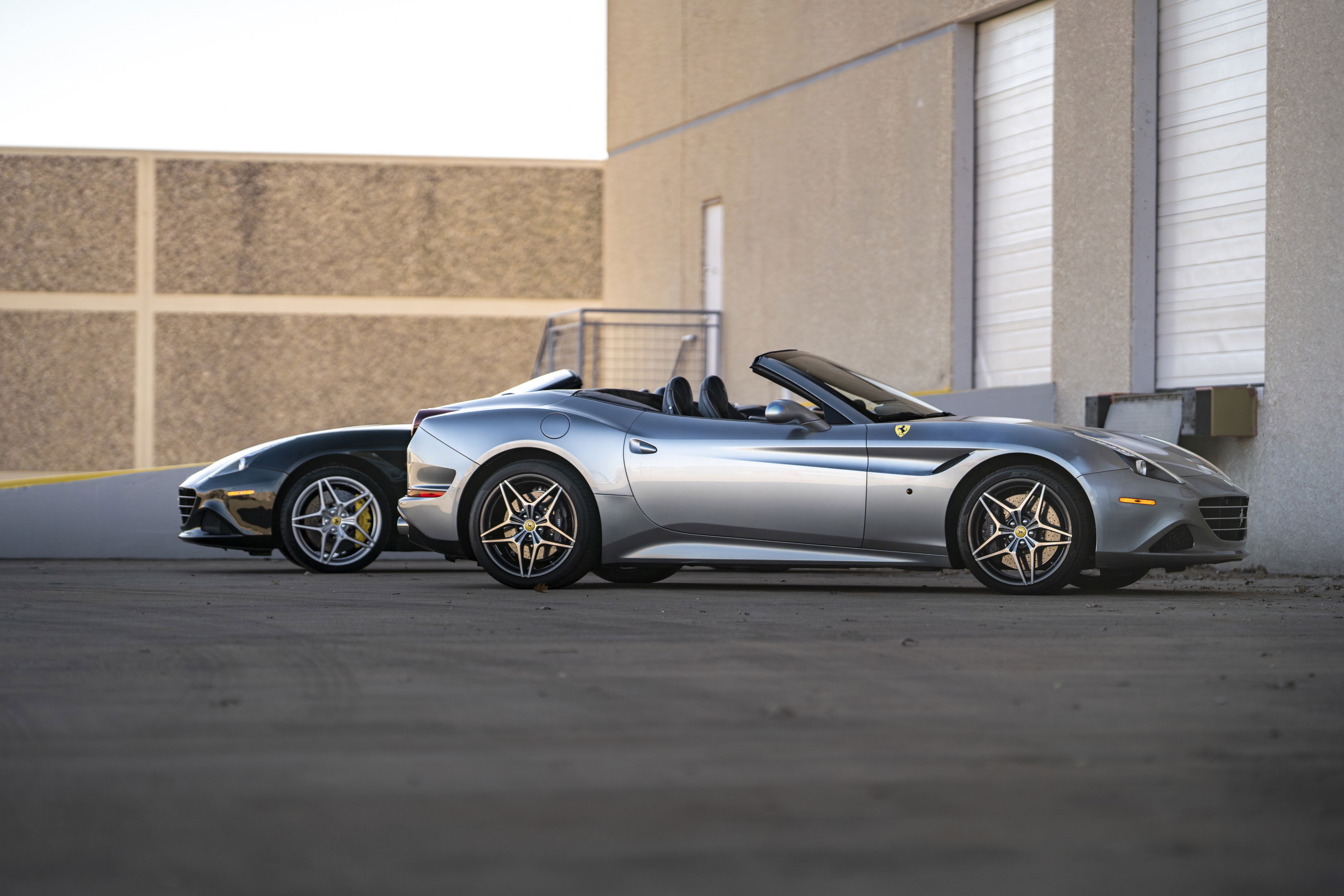 Silver 2016 Ferrari California T convertible with multi-spoke rims.
