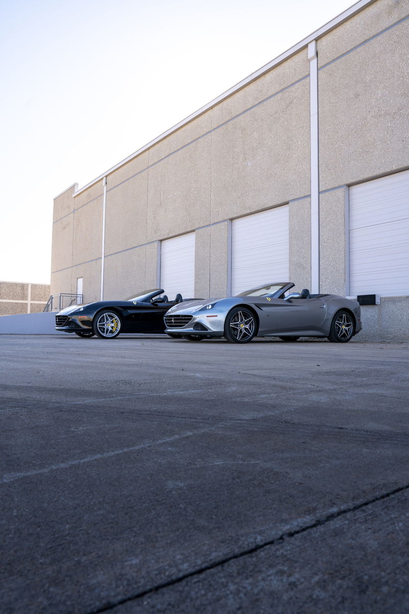 Silver 2016 Ferrari California T convertible with a black interior and multi-spoke alloy rims.
