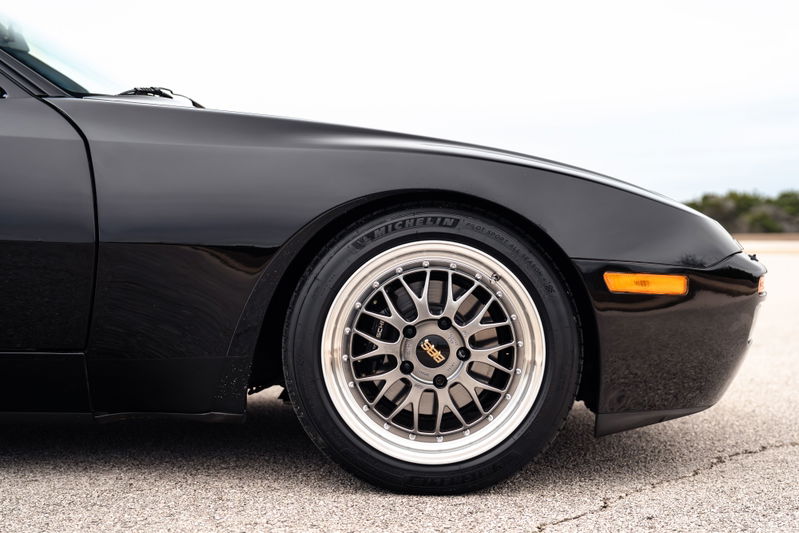 Black 1986 Porsche 944 Turbo front quarter panel with BBS rims.