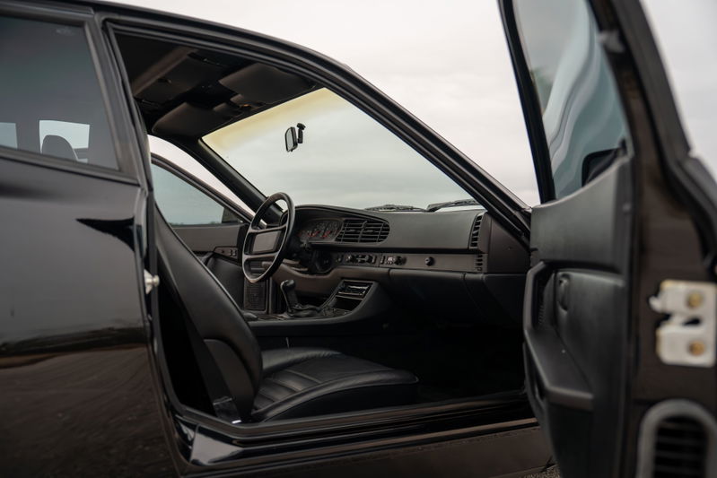 1986 Porsche 944 Turbo interior: black leather seats, dashboard, steering wheel.