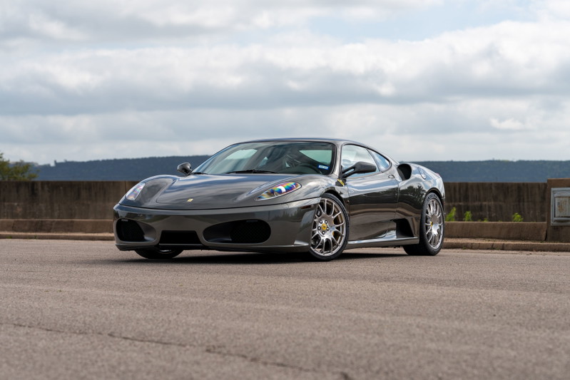 Grigio Silverstone 2007 Ferrari F430 6-speed with silver aftermarket rims.