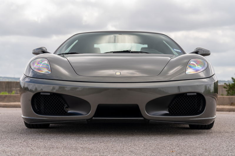 Grigio Silverstone 2007 Ferrari F430 front view, showcasing its sleek bodywork and aggressive front fascia.