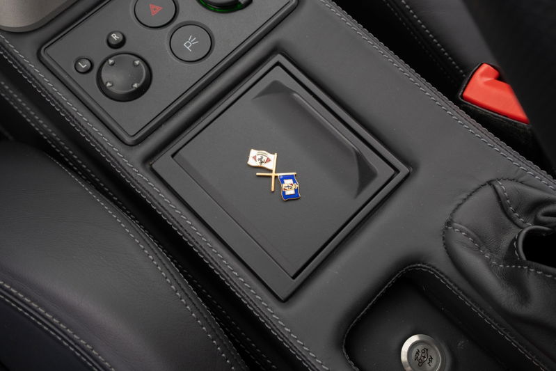 Close up of the Ferrari F430's center console with custom pins and stitching.