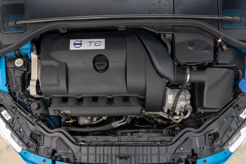 Engine bay of a 2015 Volvo V60 Polestar in Rebel Blue, featuring the T6 engine cover.