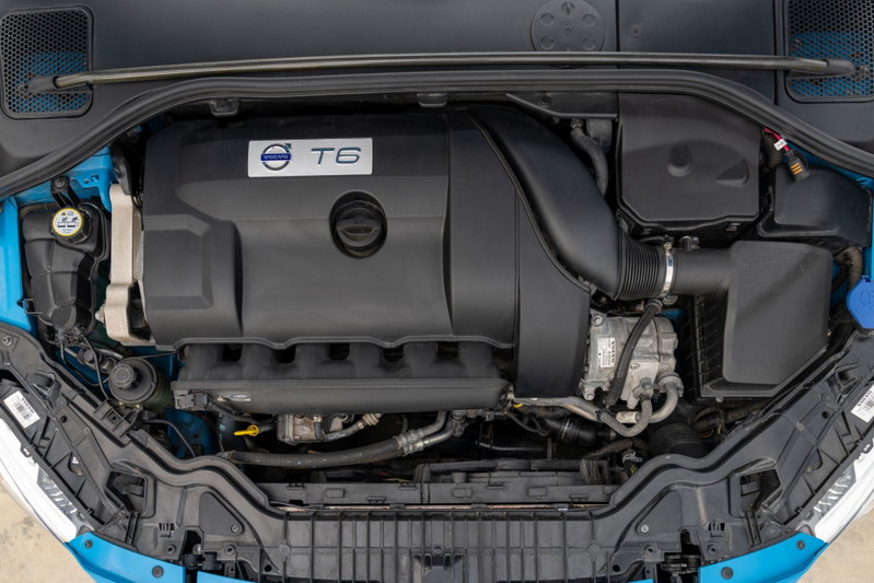 Engine bay of a 2015 Volvo V60 Polestar in Rebel Blue, featuring the T6 engine cover.