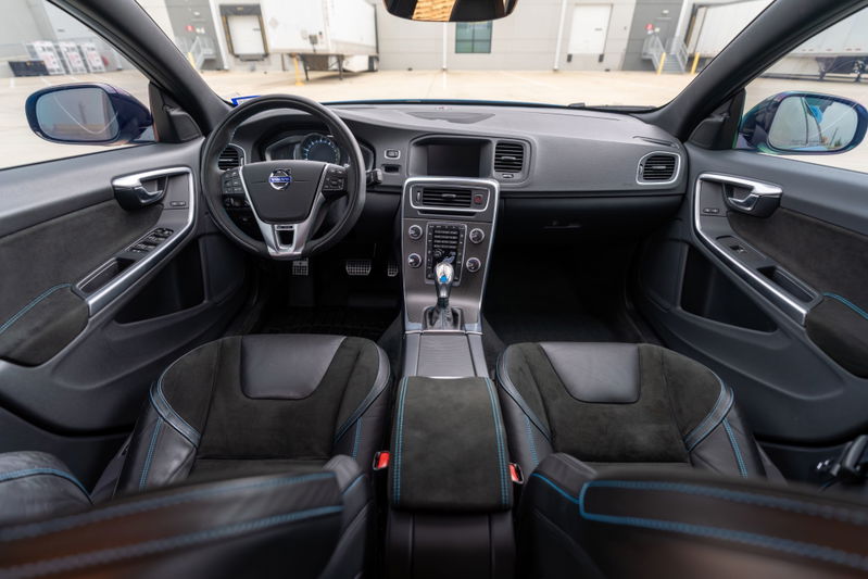 2015 Volvo V60 Polestar interior in Rebel Blue with Alcantara trim and blue stitching on seats.