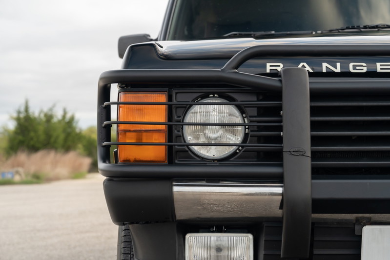 1994 Land Rover Range Rover County LWB front-right close-up with brush guard.