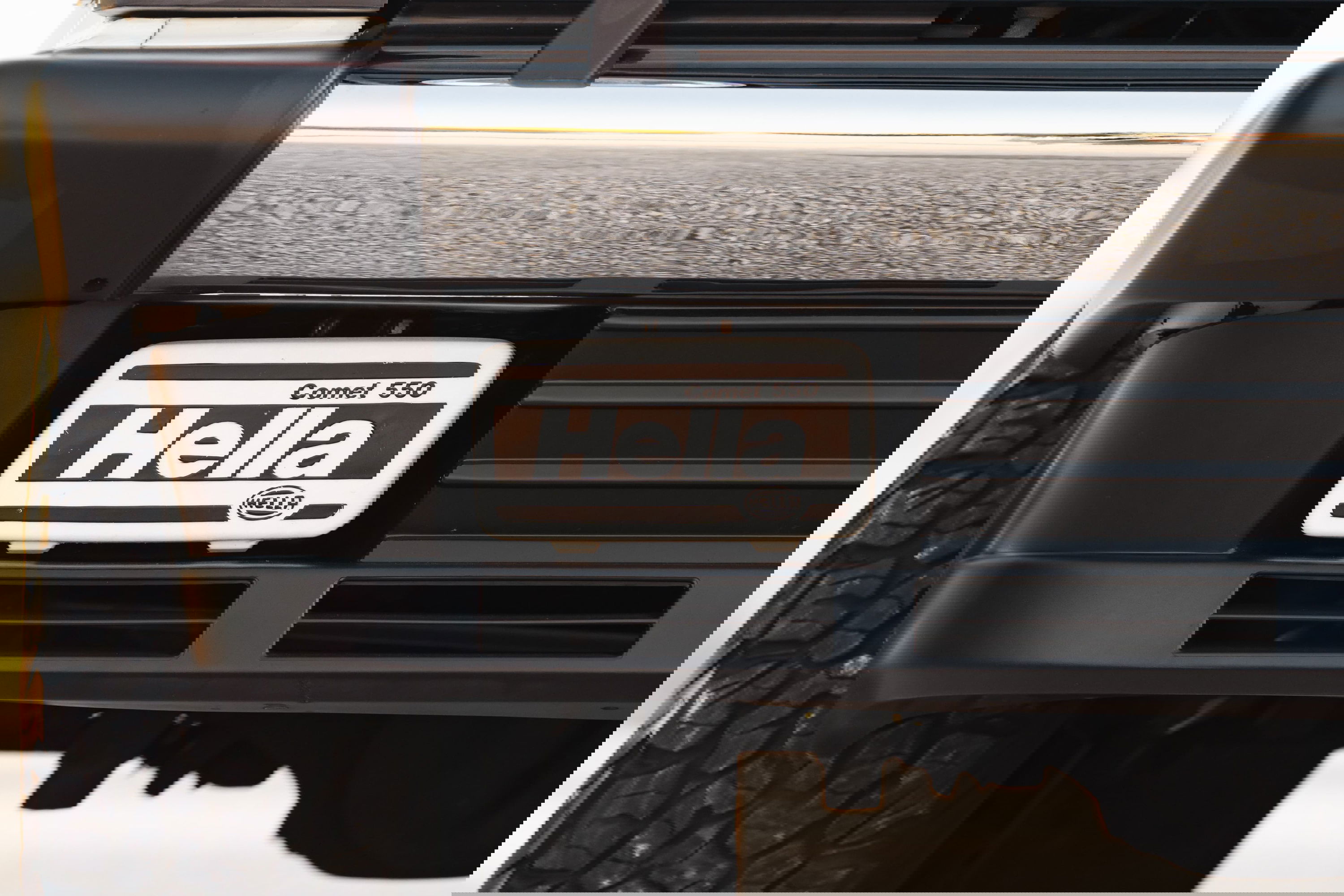 1995 Range Rover County with Hella Comet 550 fog lights and aggressive off-road tires.