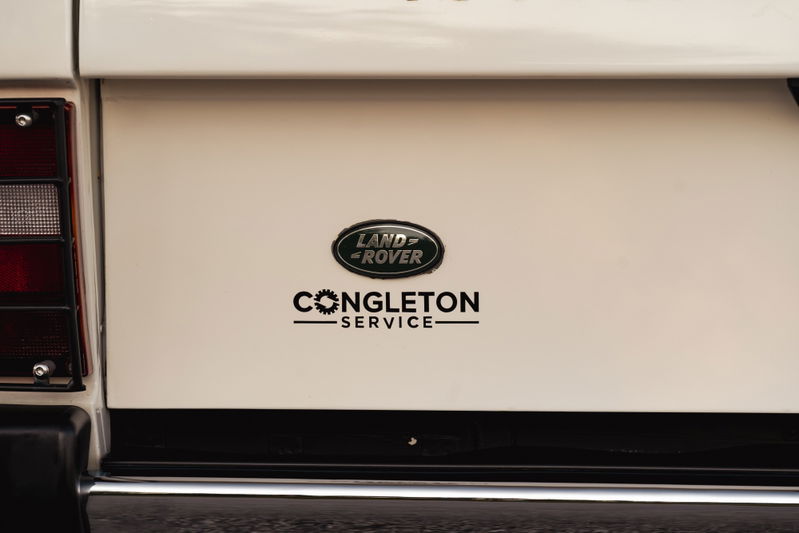 A white 1995 Land Rover Range Rover County with "Congleton Service" badging.