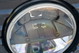 Close-up of a 1995 Land Rover Range Rover County headlight assembly.