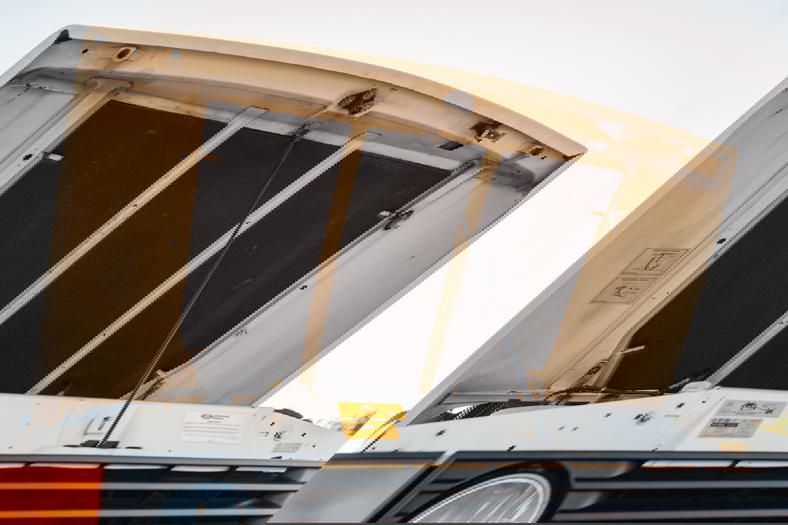 1995 Range Rover County hood insulation. Front grille and orange turn signal visible.