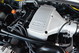 Close-up of a 1995 Land Rover Range Rover 4.2L V8 engine, showing silver intake manifold with '4.2' engraving.