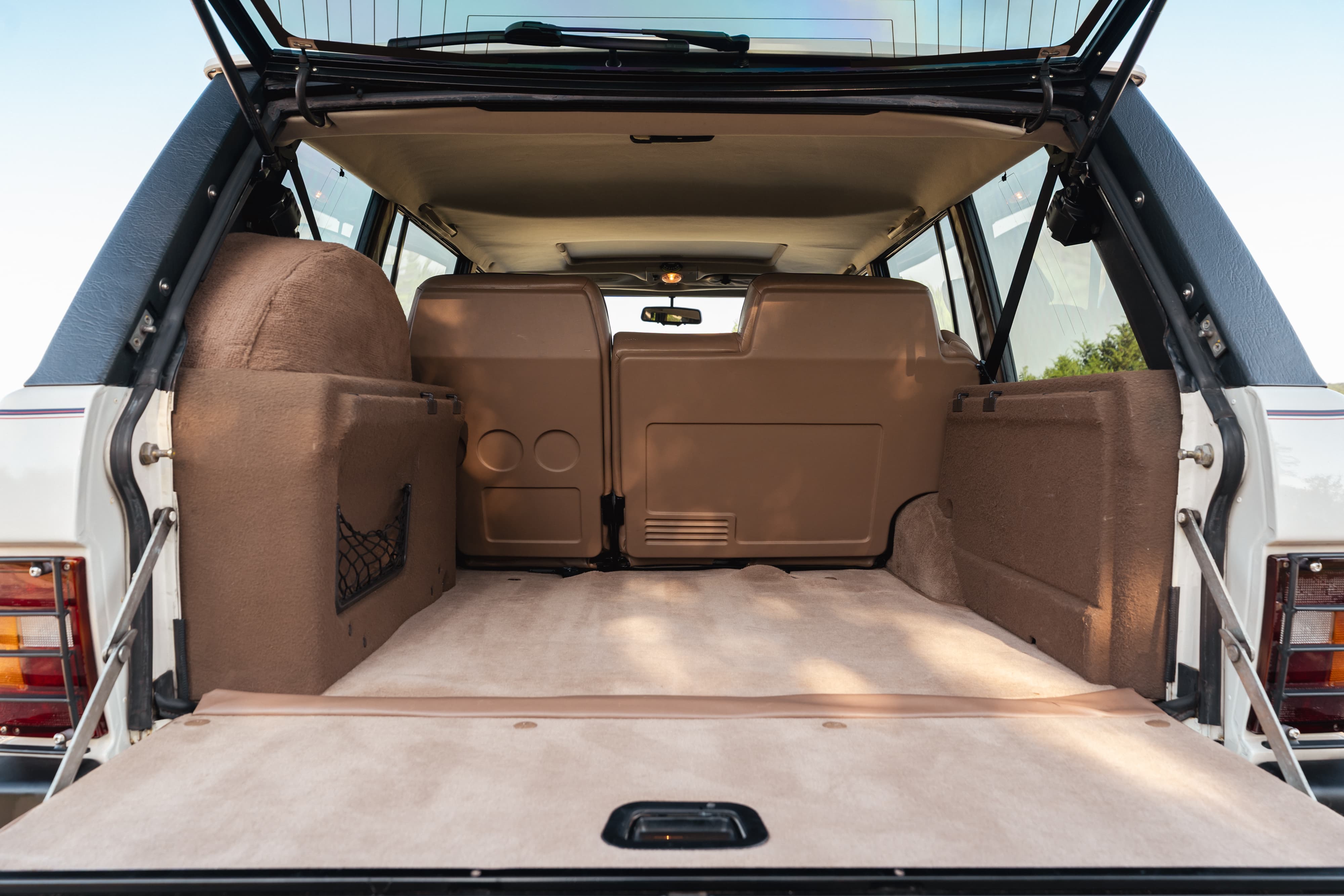 1995 white Land Rover Range Rover County rear cargo area.