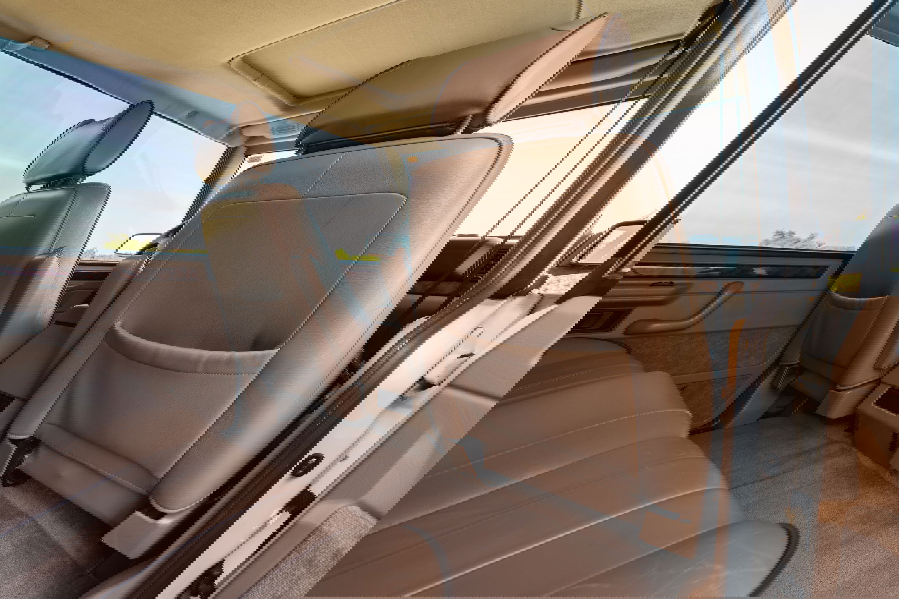 1995 Range Rover County interior: tan leather seats, wood trim, sunroof.