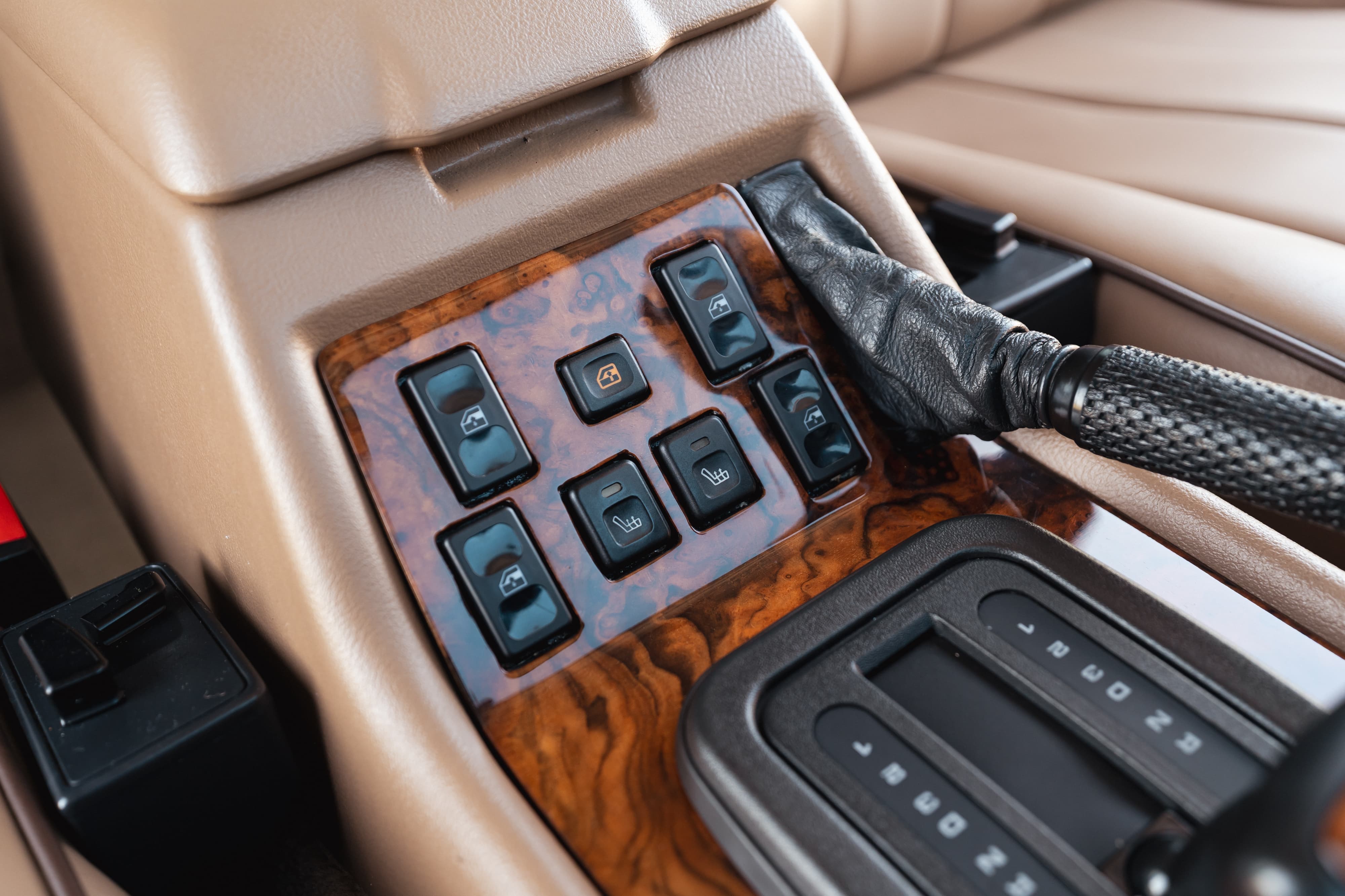 1995 Range Rover County interior: wood trim, automatic gear shifter, window controls.