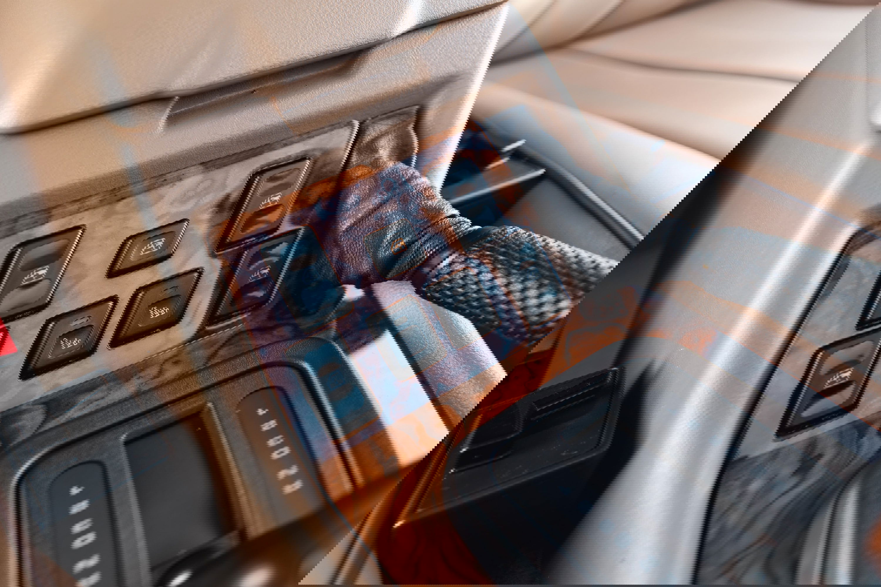 1995 Range Rover County interior: wood trim, automatic gear shifter, window controls.