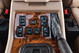 1995 Land Rover Range Rover County interior: wood trim, window and heated seat controls, leather gear shifter.