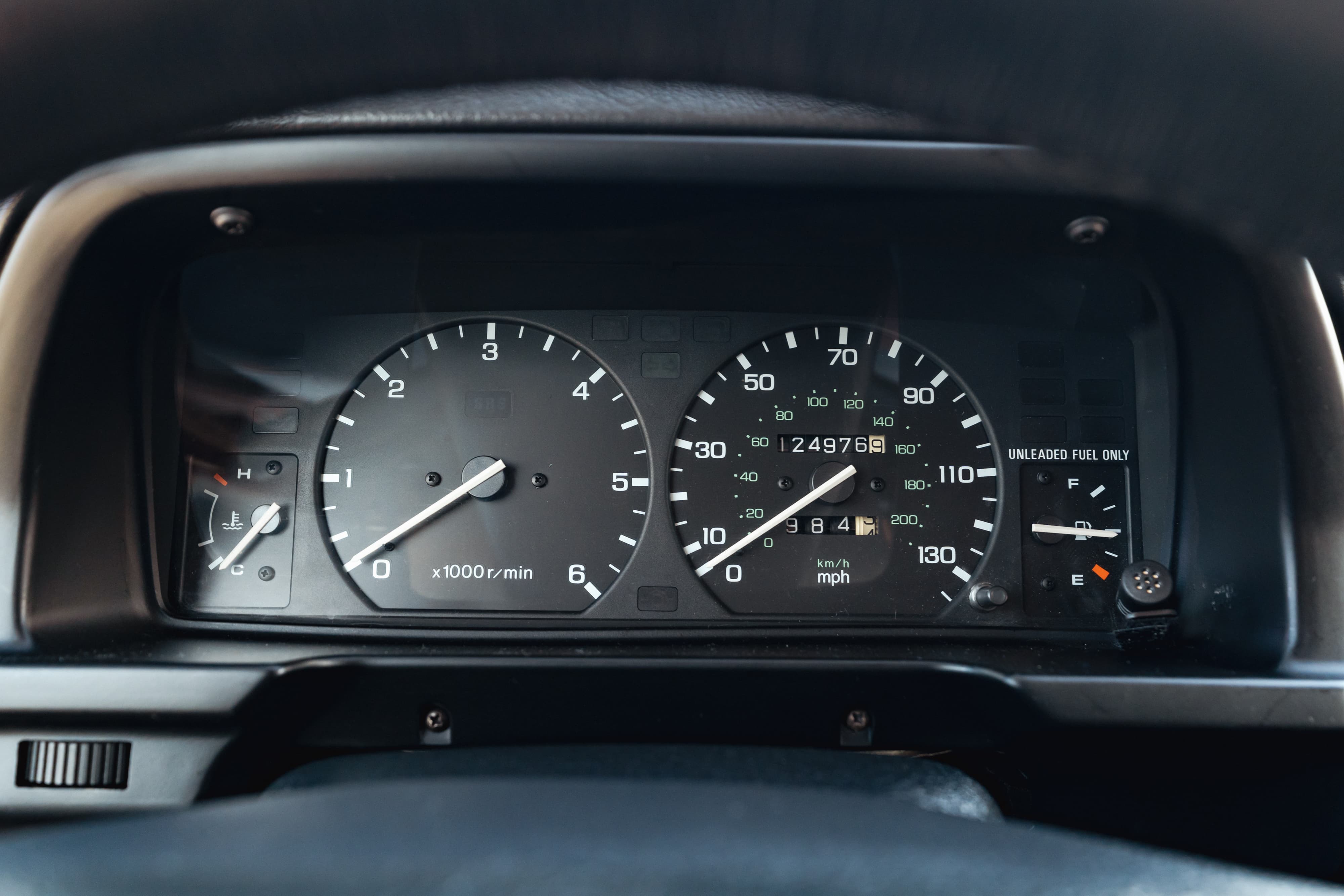 1995 white Land Rover Range Rover County dashboard, with tachometer and speedometer.