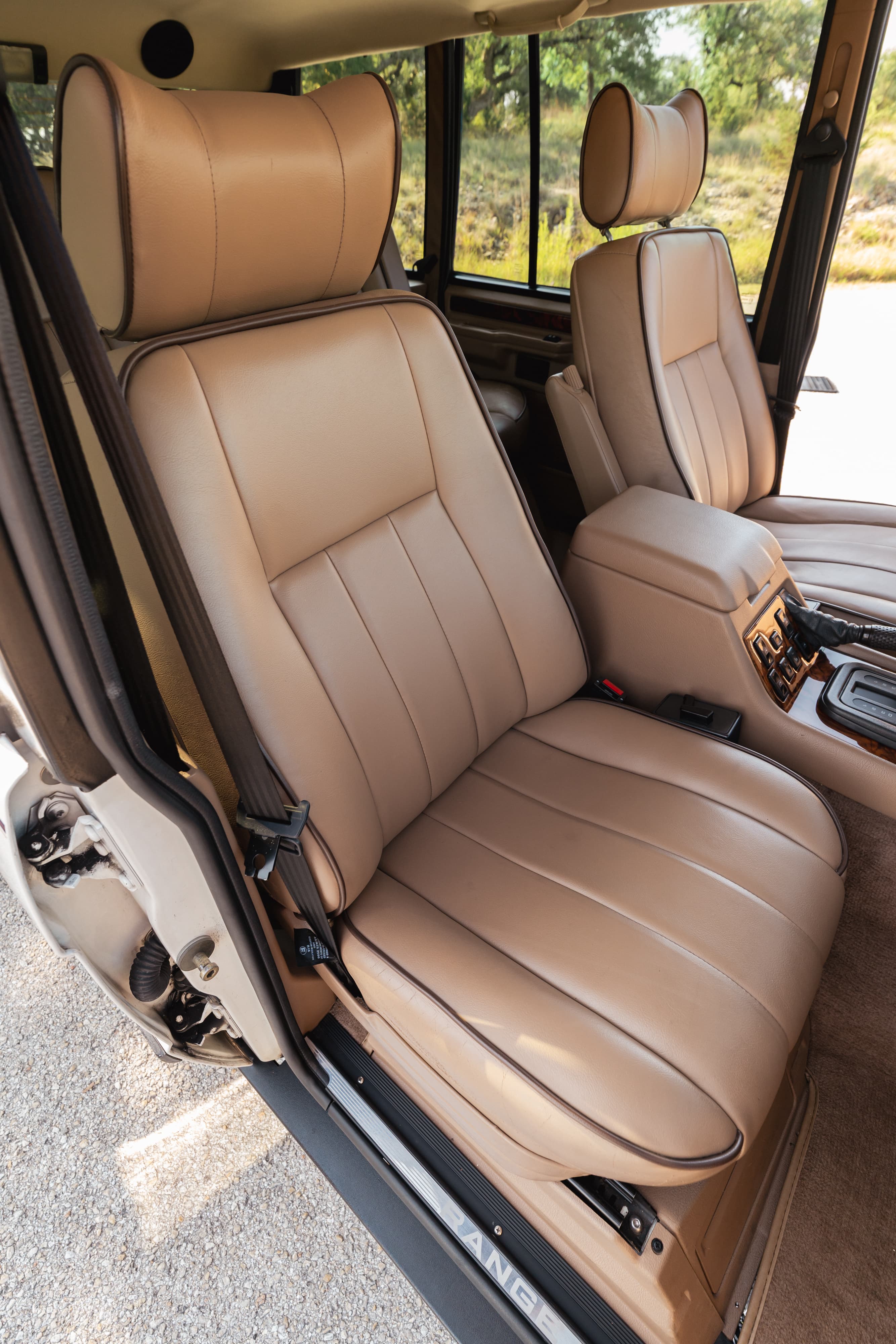 Interior of a tan 1995 Land Rover Range Rover County with leather seats.