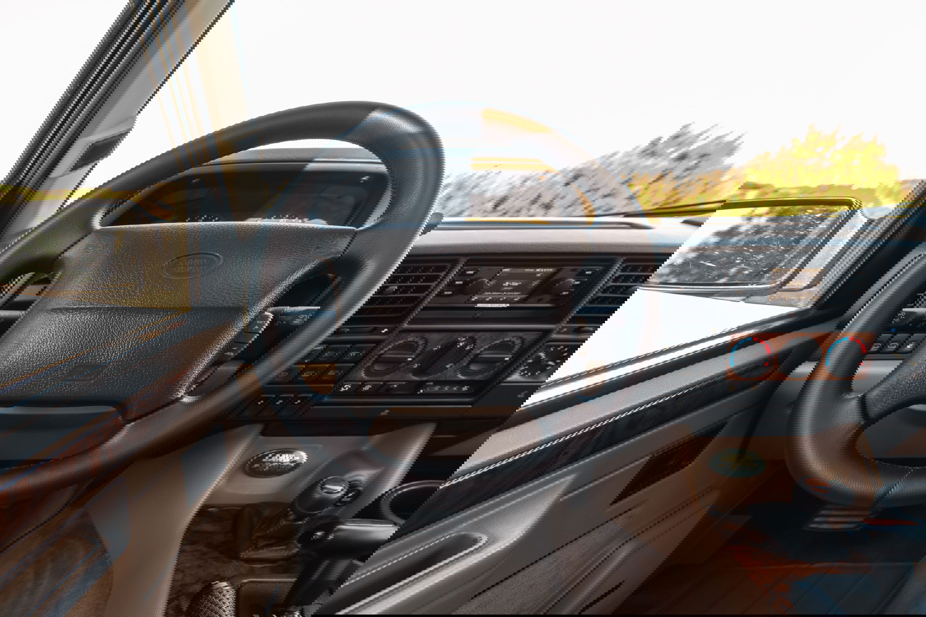 1995 Range Rover County interior: leather steering wheel, wood trim, central console.