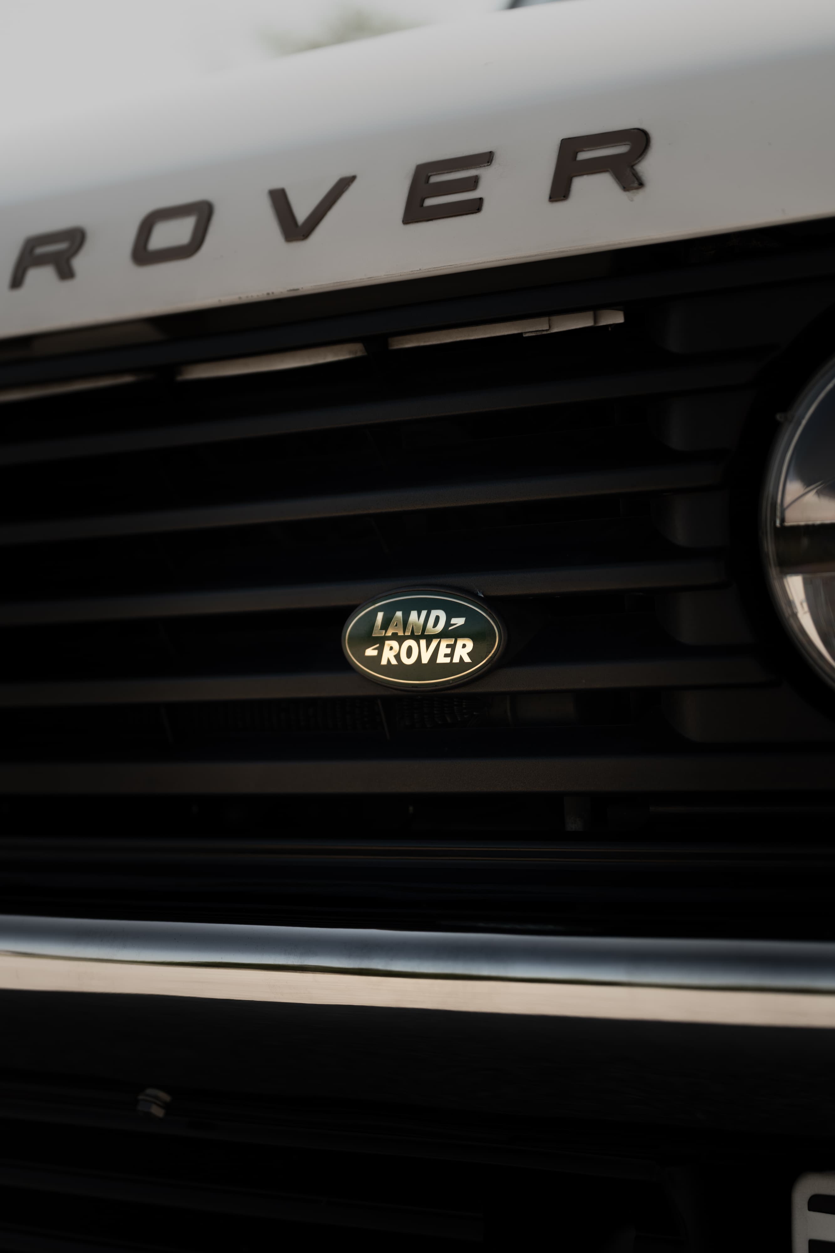White 1995 Land Rover Range Rover County grille detail with logo.
