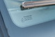 White 1995 Land Rover Range Rover windshield glass with Pilkington markings and Bosch wiper.
