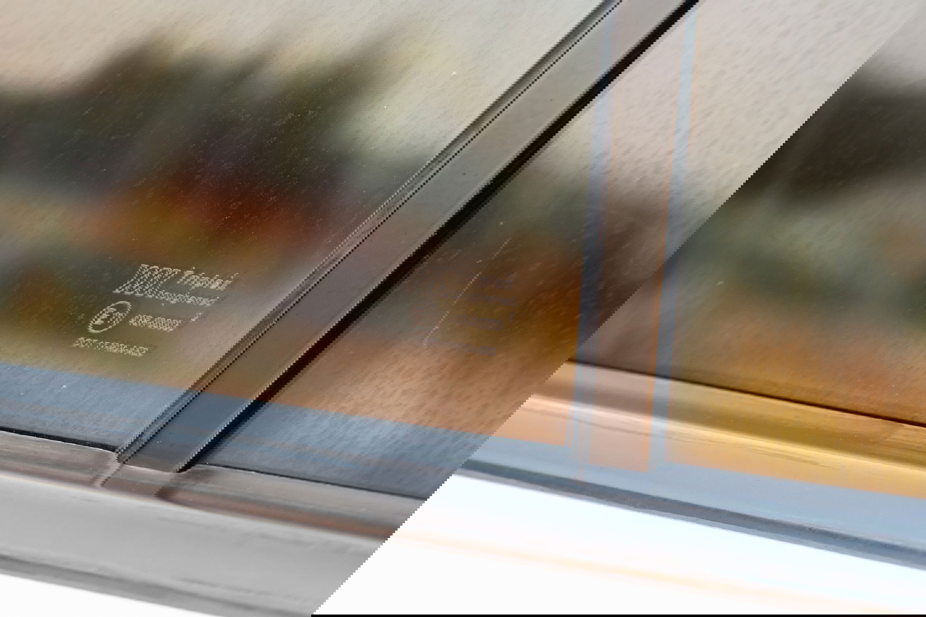 1995 white Range Rover County side window with Triplex toughened glass marking.