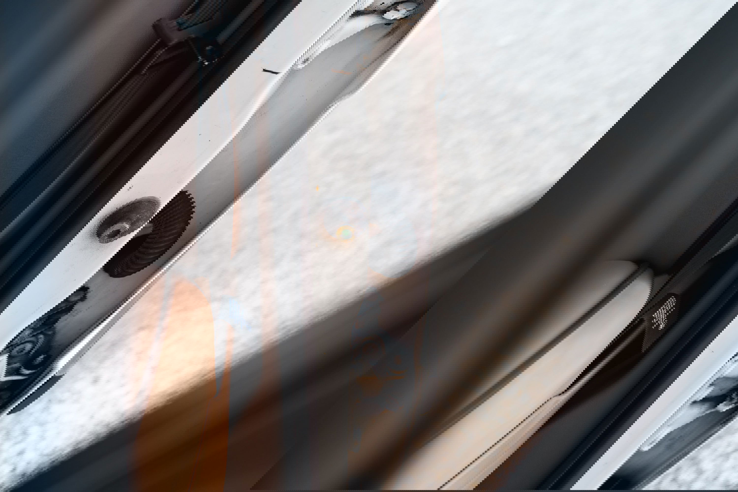 White 1995 Land Rover Range Rover County door latch mechanism and interior trim.