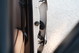 White 1995 Land Rover Range Rover County door latch mechanism and interior trim.