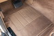 Tan carpet floor mat and pedals in a 1995 Range Rover County.