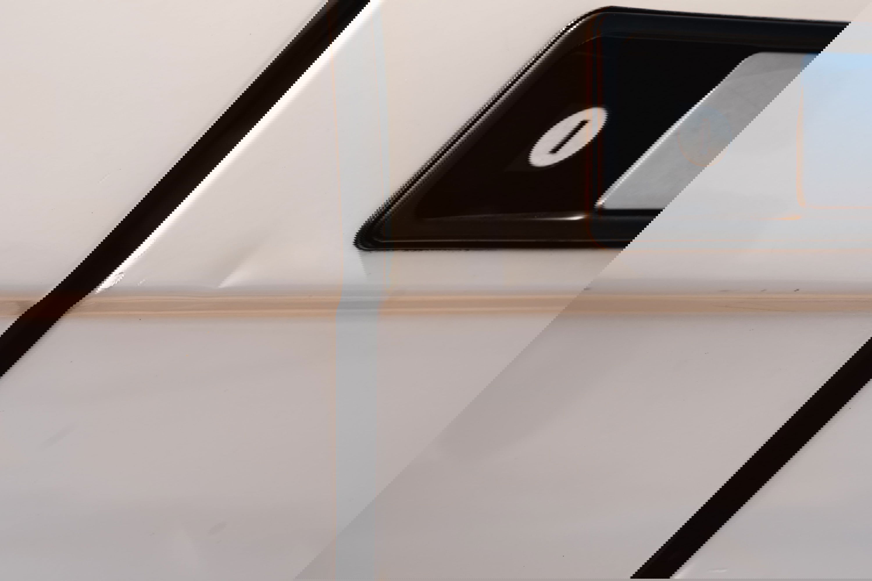 White 1995 Range Rover County door trim detail with black door handle and lock cylinder.