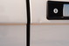 White 1995 Range Rover County door trim detail with black door handle and lock cylinder.