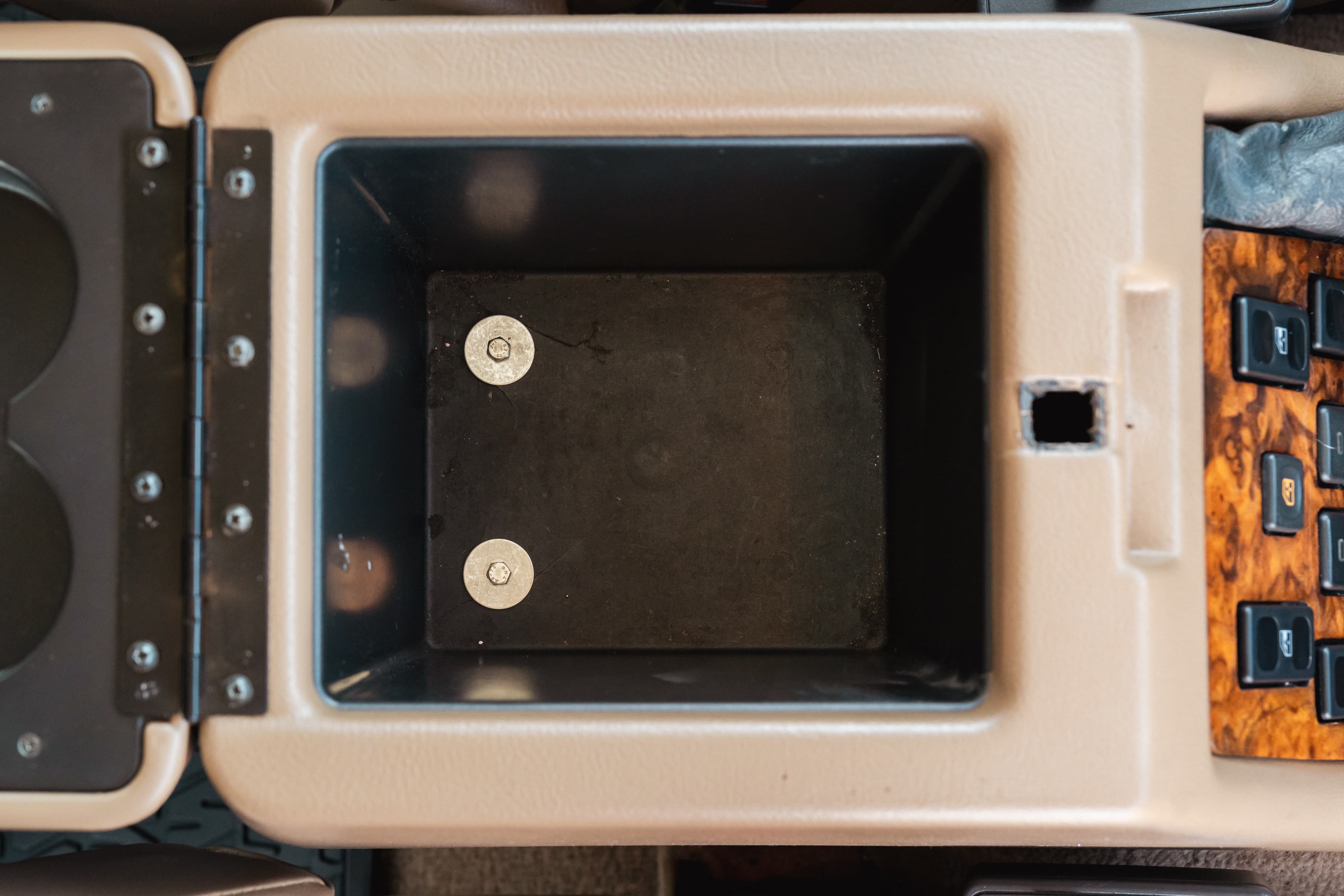 1995 White Land Rover Range Rover County center console with wood trim.