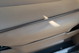 Tan interior trim detail on a 1995 Range Rover County, showing subtle texture and sunlight highlights.